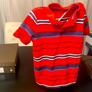 Two tommy Hill figure shirt, one red, black and white and on